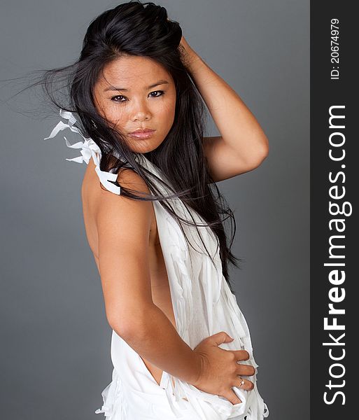 Sexy Young Asian Woman In White Fringed Top