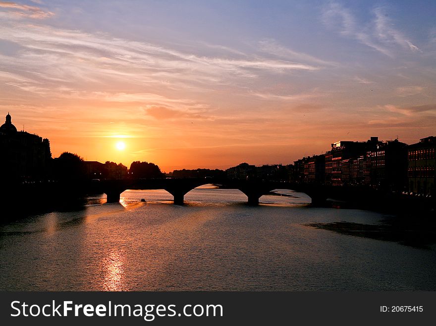 The sunset and the ancient bridge in Florence. The sunset and the ancient bridge in Florence.