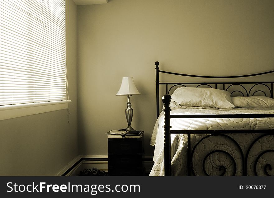 Sepia toned bedroom in the late afternoon