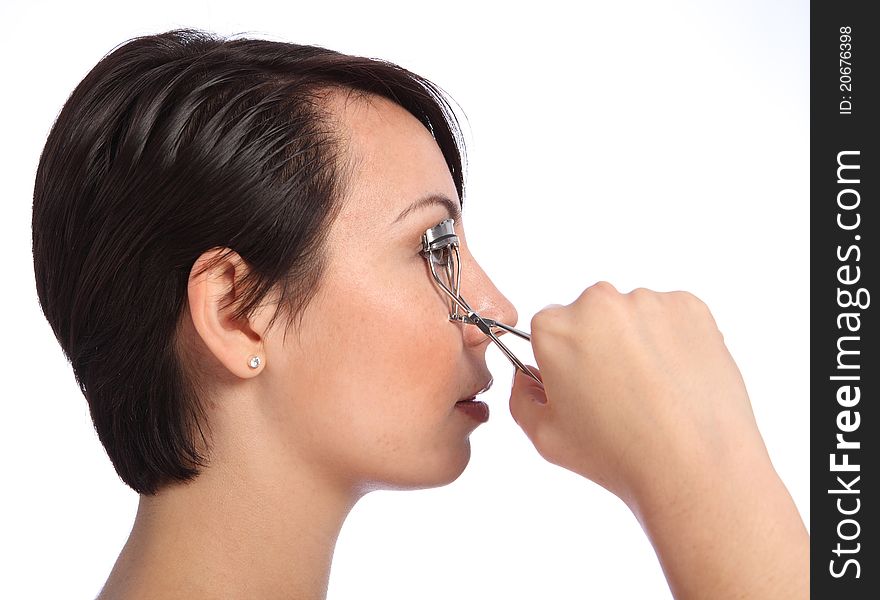 Beautician Woman Using Eye Lash Curler In Make Up