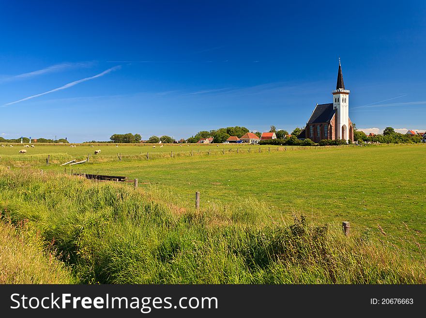 Church with grassland on a sunny day in spring