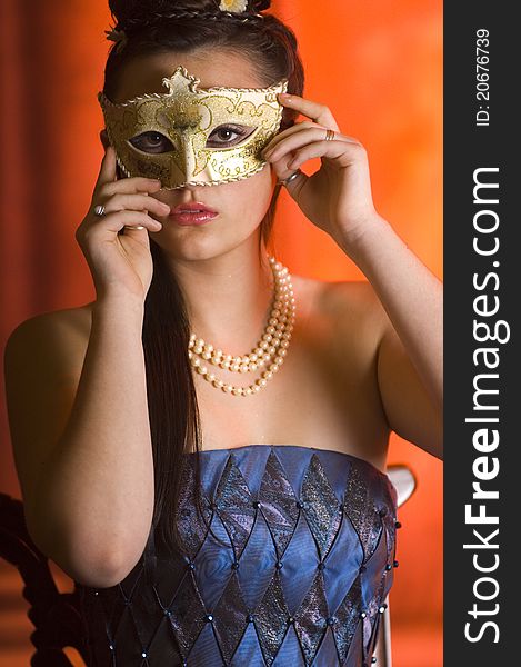 Young Teen woman at Masquerade Ball with long dark hair