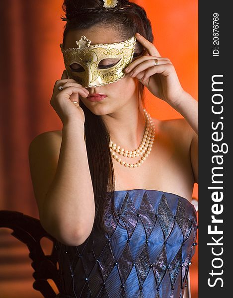 Young Teen woman at Masquerade Ball with long dark hair