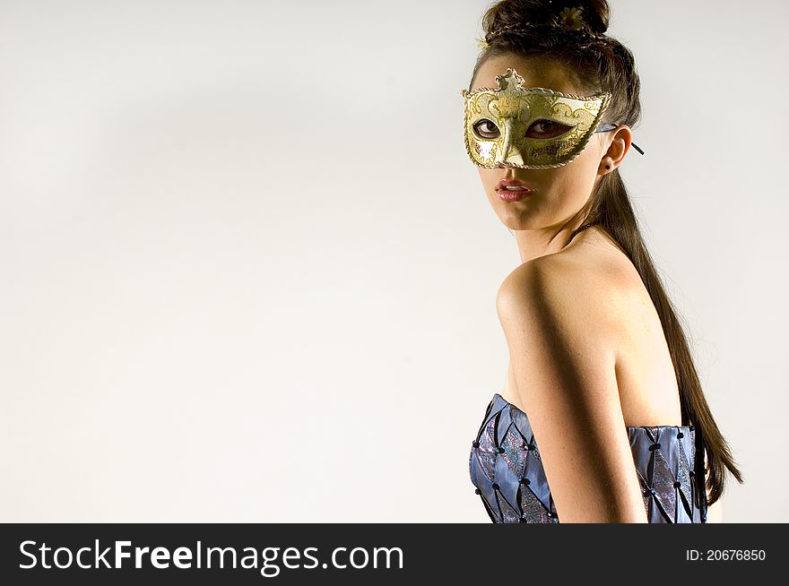Young Teen woman at Masquerade Ball with long dark hair