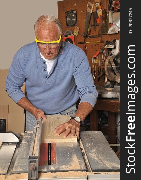 Senior Man Carpenter Working With Wood