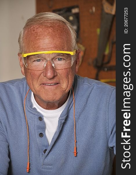 Senior Man Carpenter Working with Wood