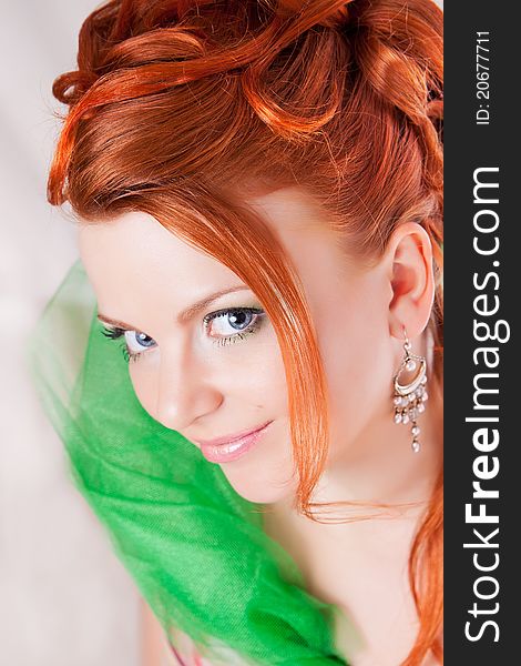 Portrait of the red haired girl with a penetrating glance. Portrait of the red haired girl with a penetrating glance