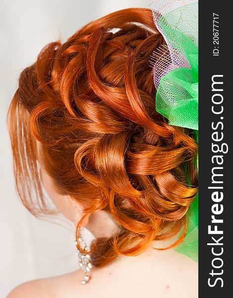 Hairdress of the girl with red hair