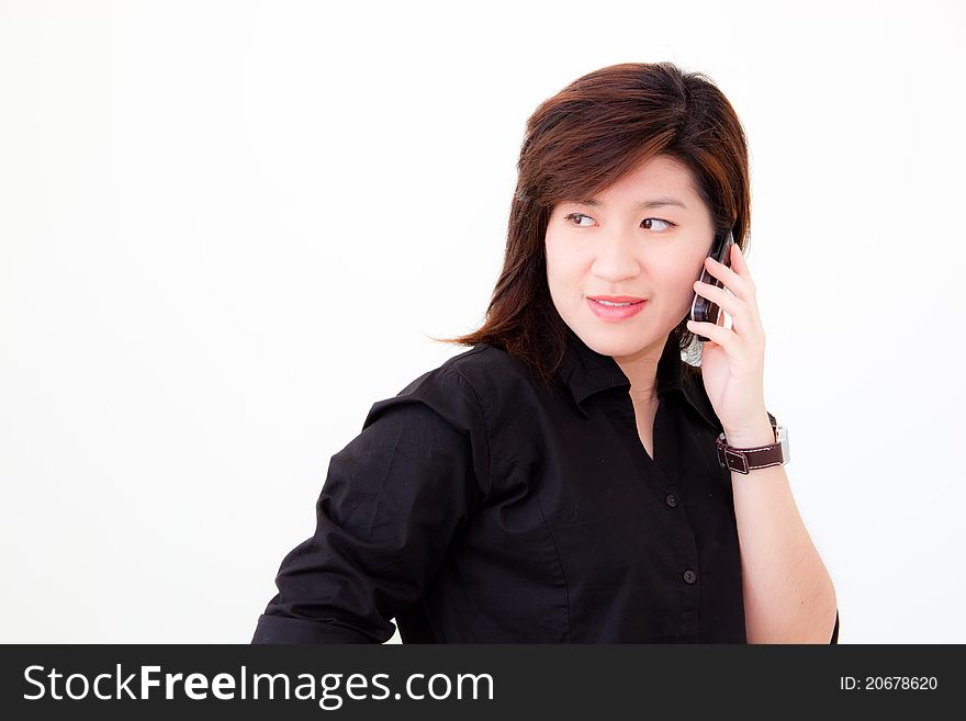 Asian woman in black shirt holding the telephone on white background. Asian woman in black shirt holding the telephone on white background