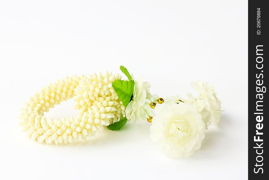 Jasmine garland on a white background (craft plastic, not natural)