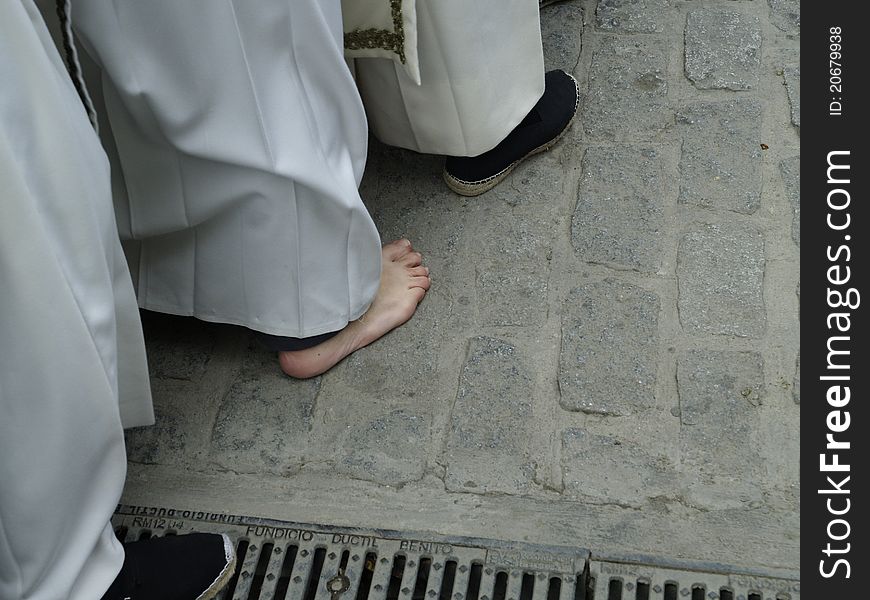 Detail of Easter in Baeza, Spain. it's the barefoot of a penance