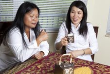 Asian Women Drinking Tea Royalty Free Stock Photo