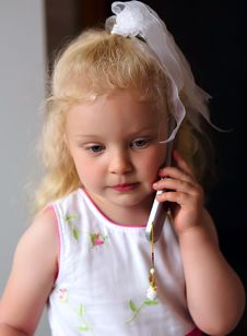 Little Caucasian Girl Listening To Mobile Phone Stock Photo Little Caucasian Girl Listening To Mobile Phone Stock Photo