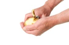 Hands Peeling A Potato Stock Photo