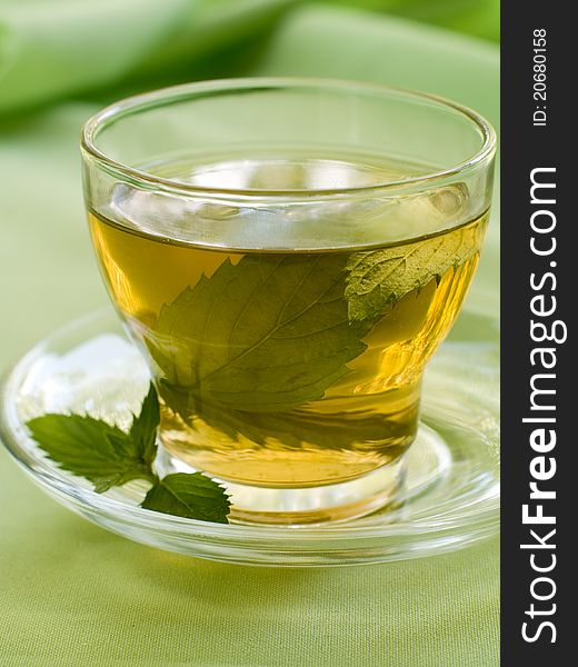 Closeup of fresh mint tea, focus on the mint leaves in the water