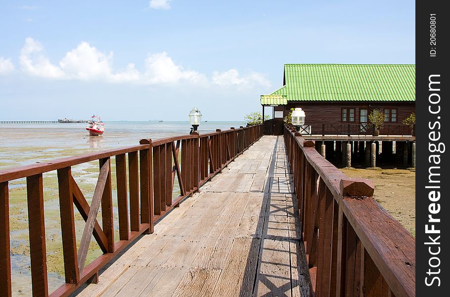 The wooden path leading to the pier. The wooden path leading to the pier