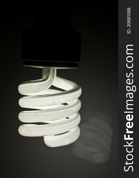 Energy saving light bulb on background