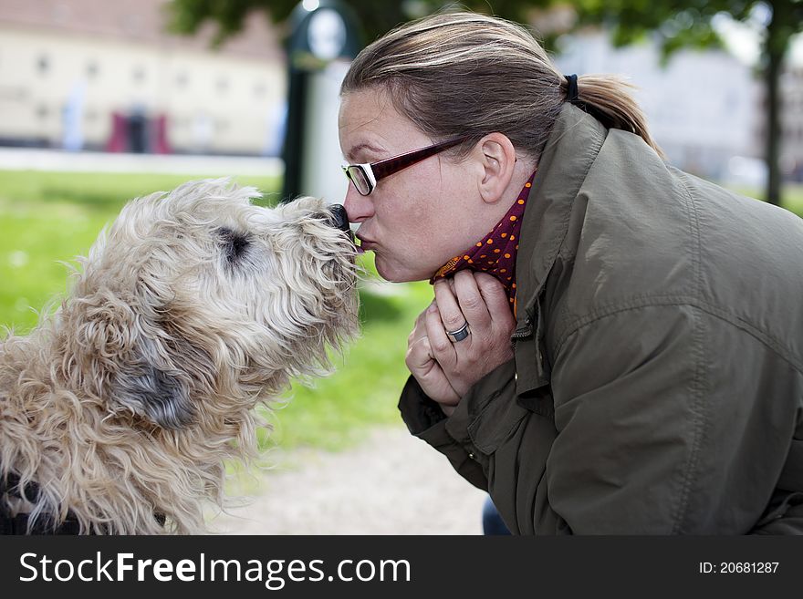 Woman and her dog with love in the park. Woman and her dog with love in the park