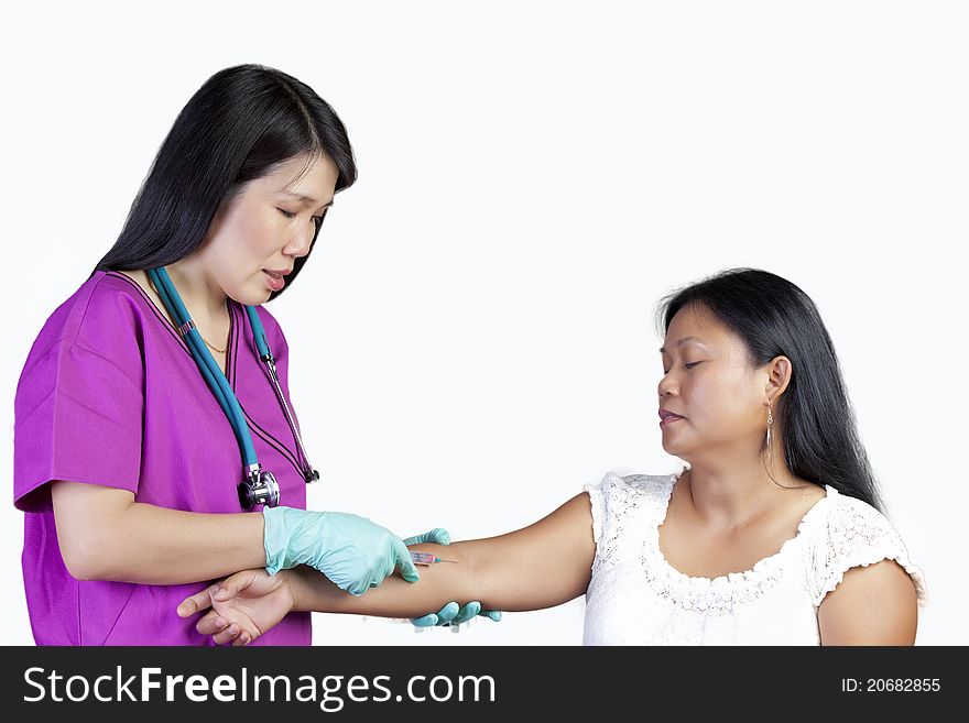 Nurse and patient with syringe on white background. Nurse and patient with syringe on white background