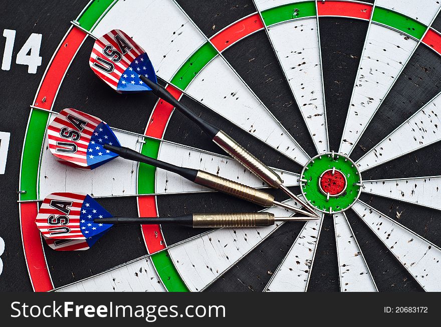 Close up of 3 darts on the dartboard. Close up of 3 darts on the dartboard