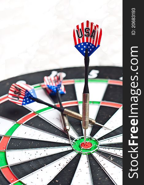 Close up of 3 darts on the dartboard. Close up of 3 darts on the dartboard