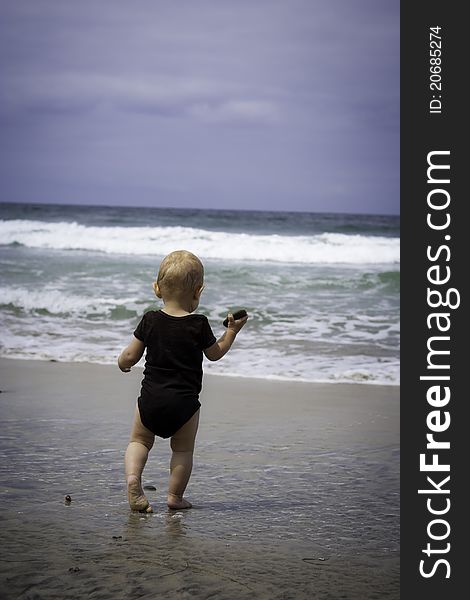 Toddler playing at the beach