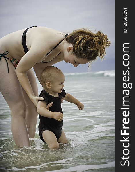 A toddler exploring the beach for the first time. A toddler exploring the beach for the first time