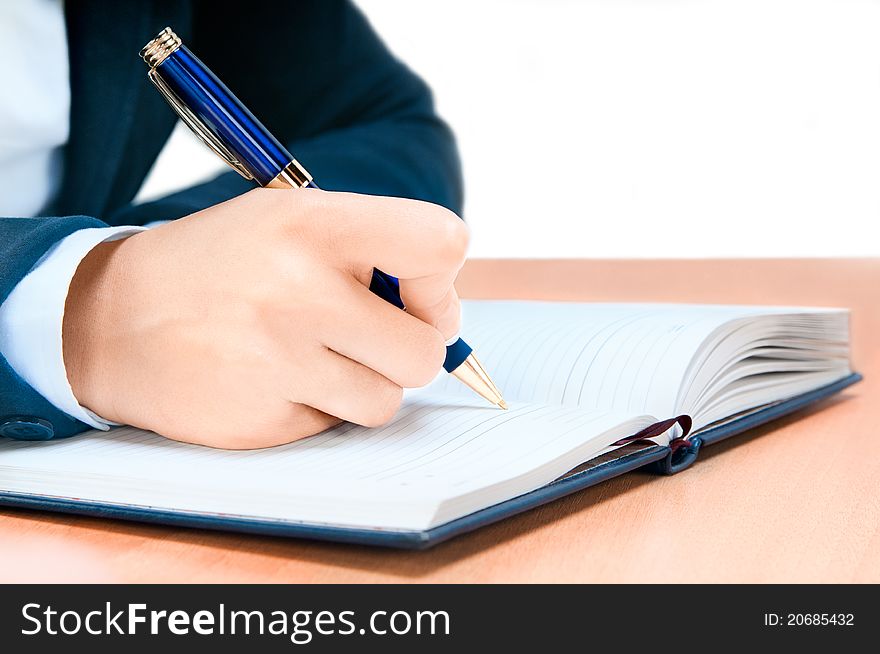 Hand Of Young Woman Taking Notes