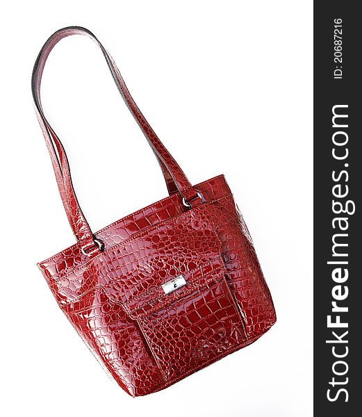 Red Crocodile textured leather shoulder handbag isolated on white background