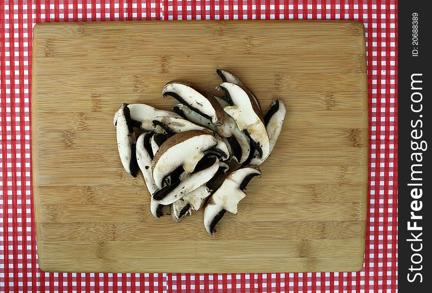 Fresh Sliced Portabella Mushrooms On Cutting Board