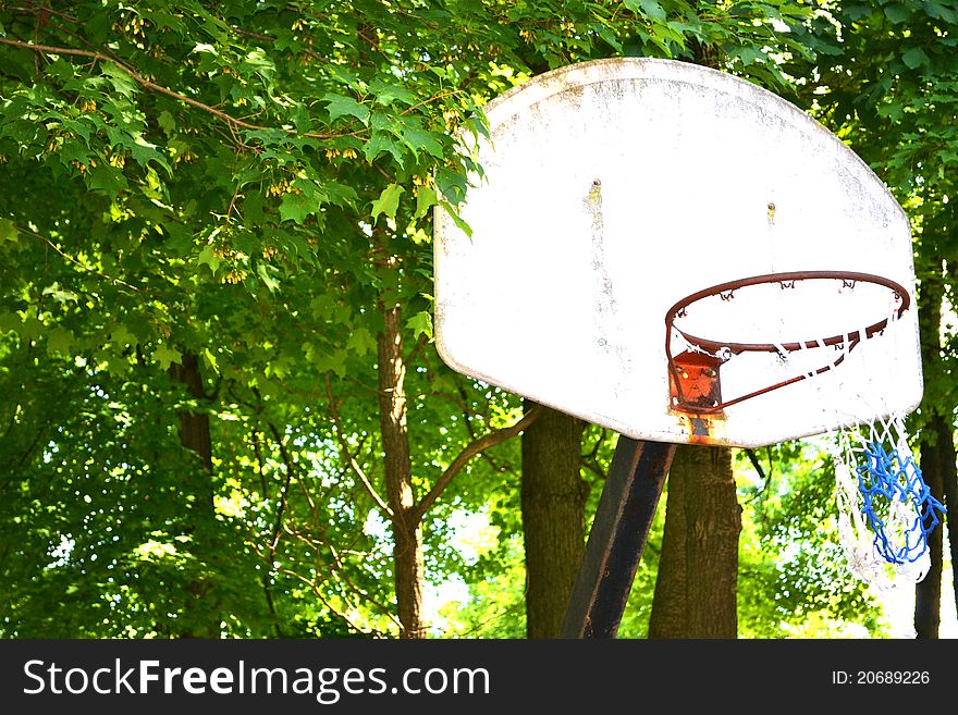 An old, rusty basketball hoop with a vintage feel. An old, rusty basketball hoop with a vintage feel.