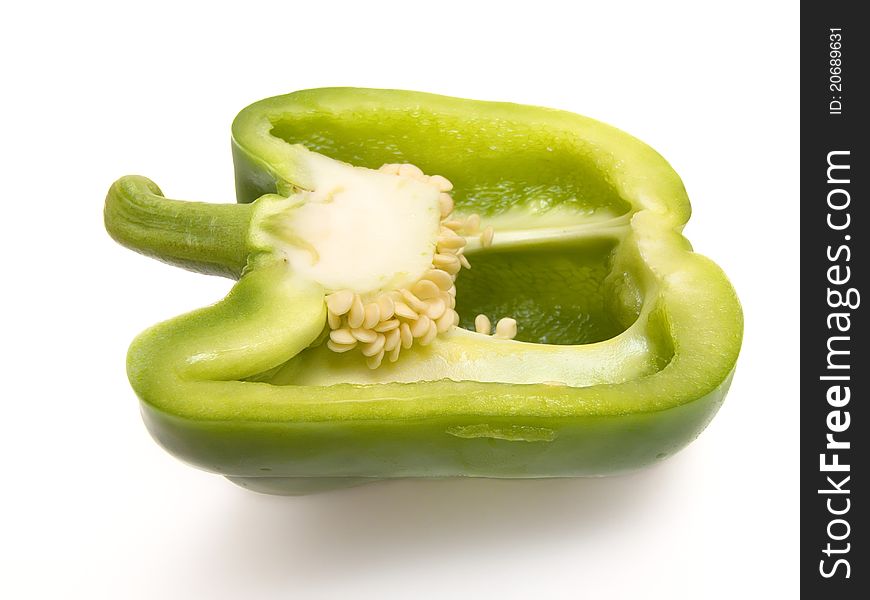 Close-up of green paprika on white background