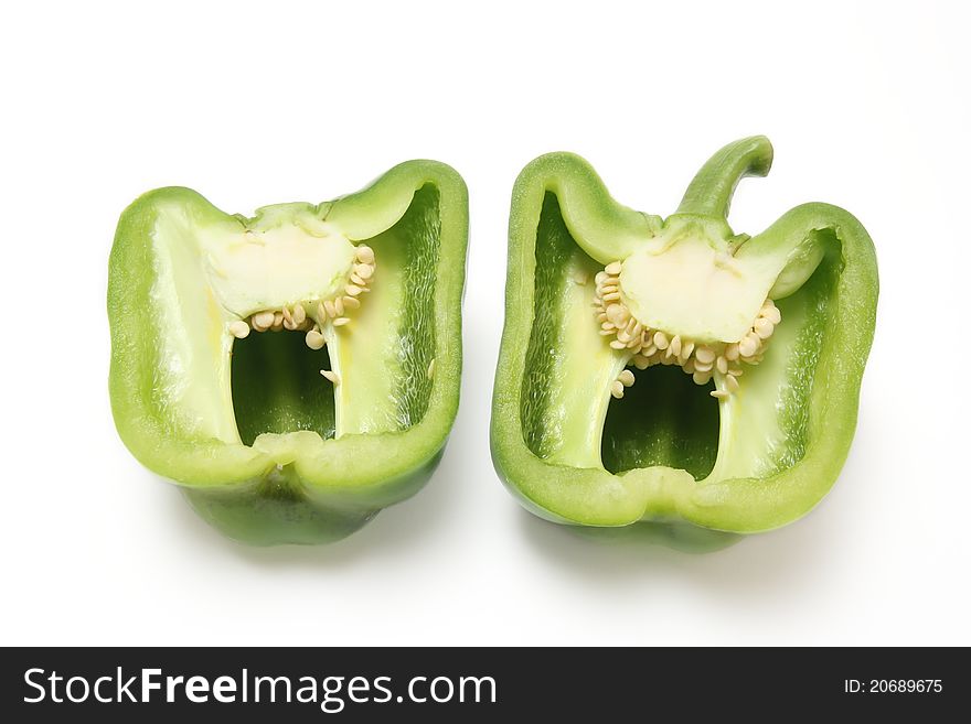 Close-up of green paprika on white background