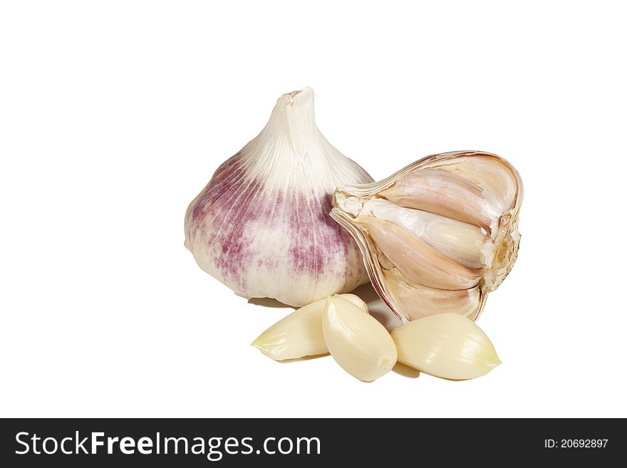 Garlic bulbs and cloves isolated on white. Garlic bulbs and cloves isolated on white