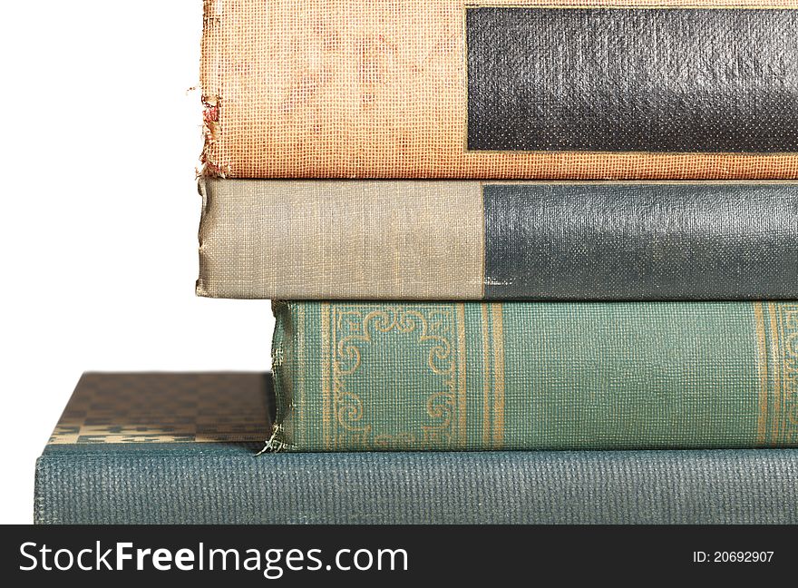 A close-up of a stack of old overused books. A close-up of a stack of old overused books