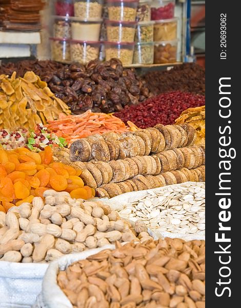 Colorful healthy dried fruits and nuts in the market, focus on figs. Colorful healthy dried fruits and nuts in the market, focus on figs