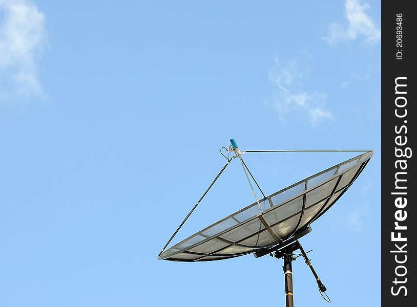 Satellite dish on blue sky background. Satellite dish on blue sky background