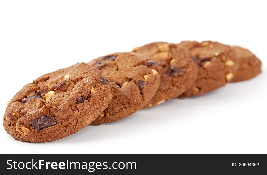 Cookies with nuts and chocolate on a white background