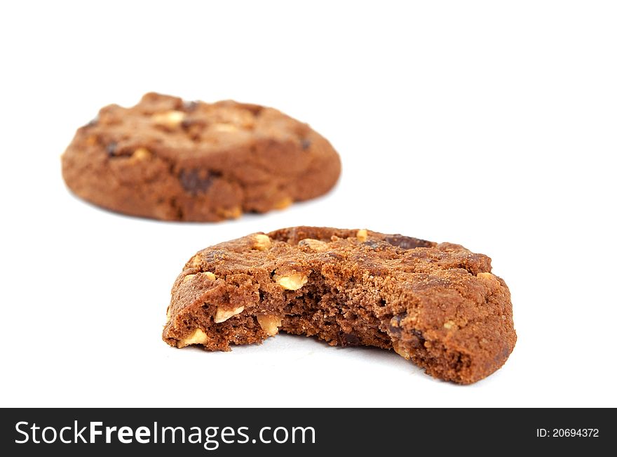 Cookies with nuts and chocolate on a white background