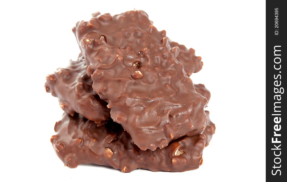 Biscuits with chocolate and nuts on white background