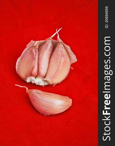 Garlic isolated on red baclground