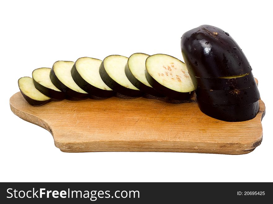 A partially sliced aubergine isolated in white background