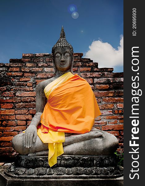 Image of Buddha in brick background