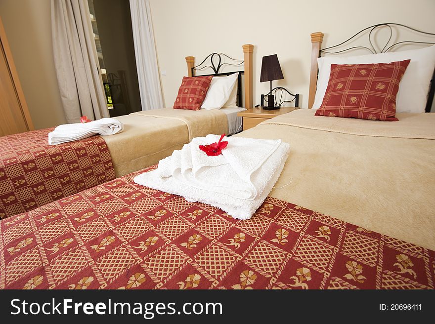 Two single beds in a twin bedroom showing interior decor and design. Two single beds in a twin bedroom showing interior decor and design