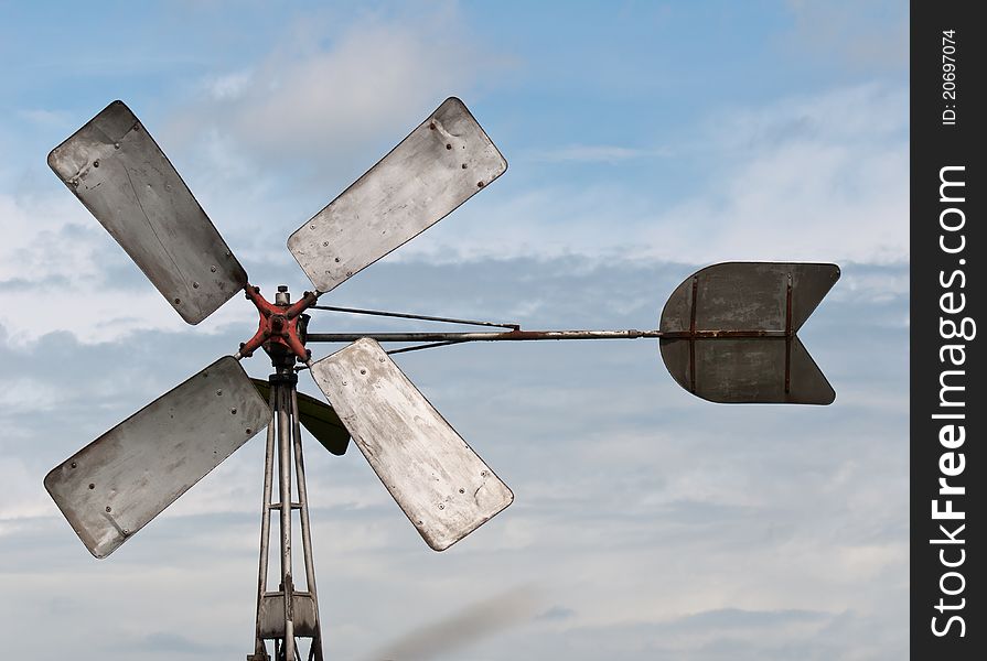 Close-up of an old Dutch windmill and a cloudy sky