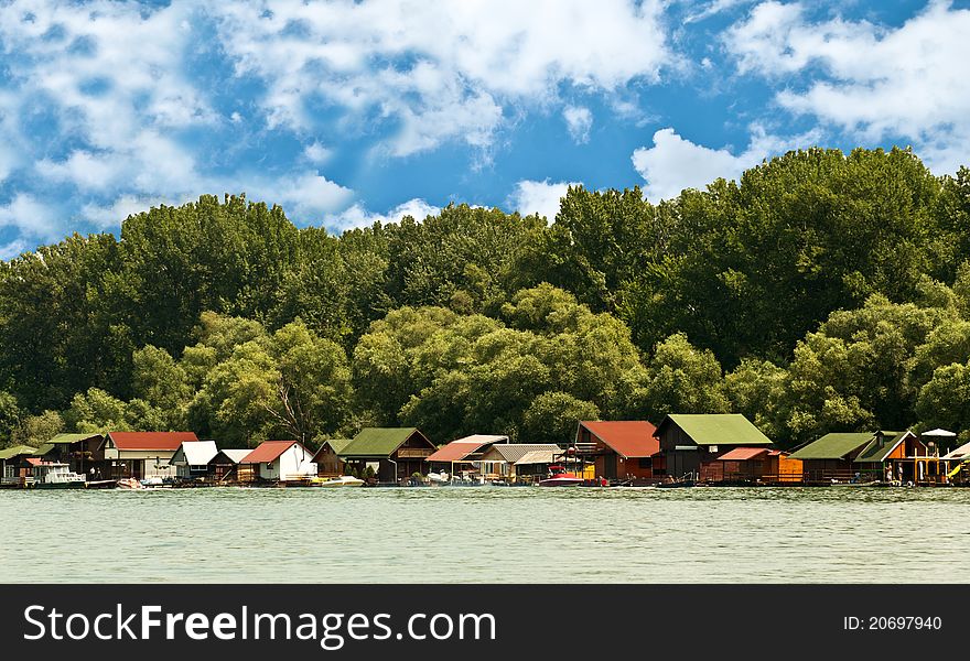 Boathouses on river