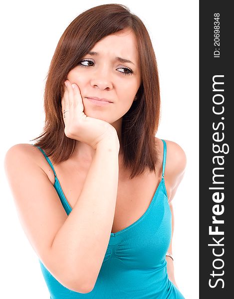 Isolated portrait of an attractive young woman suffering from toothache