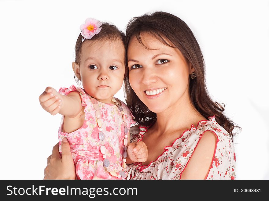 Cute mom with her daughter on a white. Cute mom with her daughter on a white