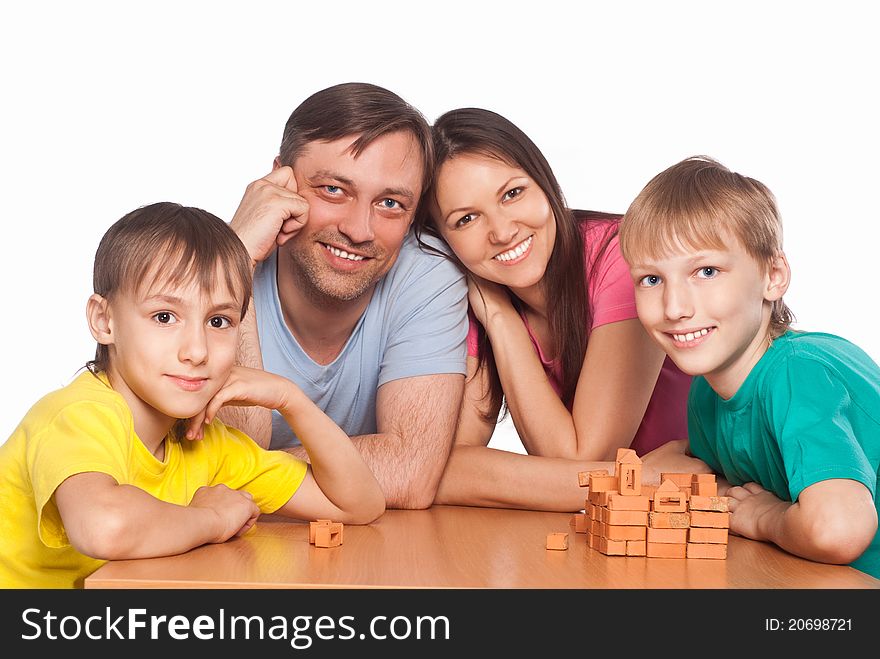 Portraitof a cute family playing at table