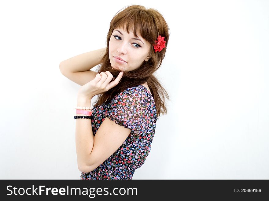 Closeup portrait of a beautiful girl over white wall